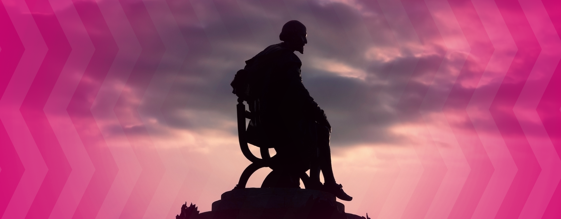 statue of william shakespeare as seen from side against pink sunset